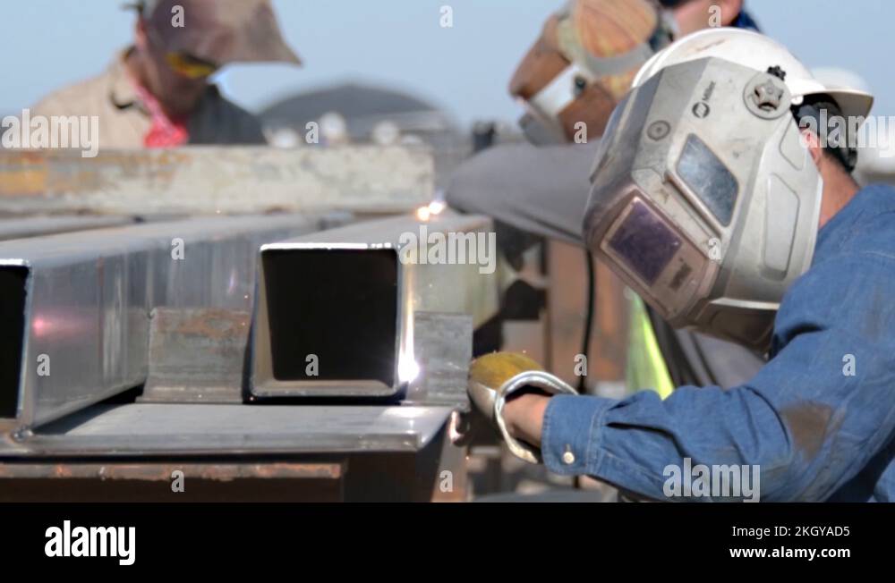 Contractor welding section of panel for new Mexican border barrier