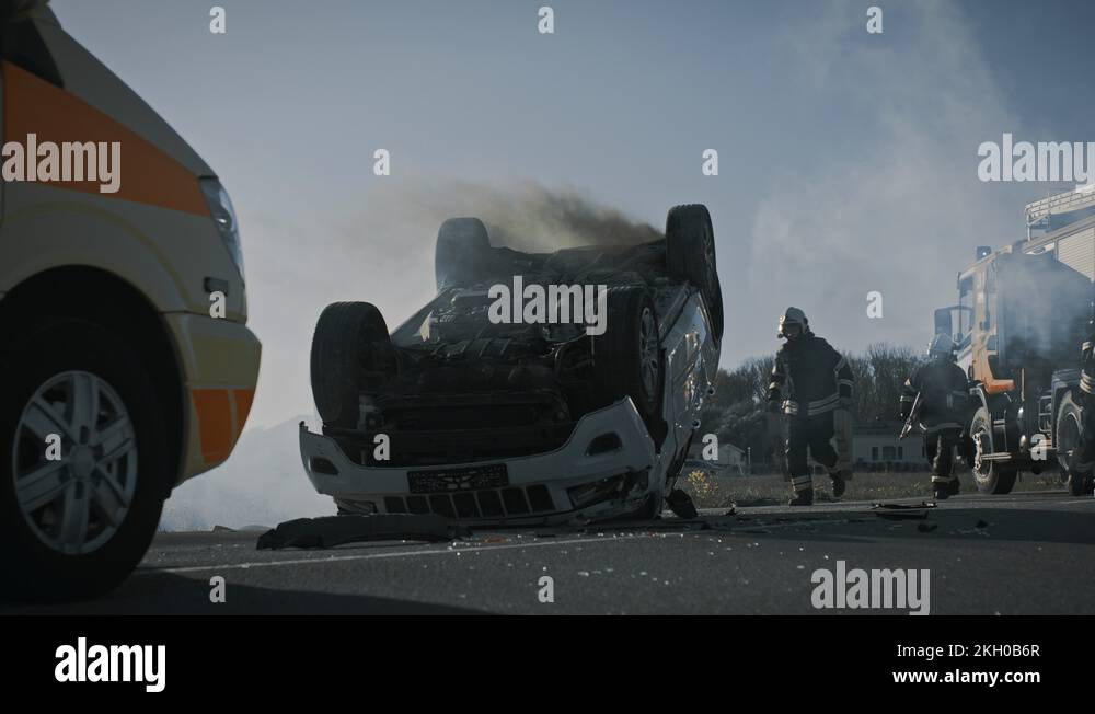 Paramedics and Firefighters Arrive On the Car Crash Traffic Accident