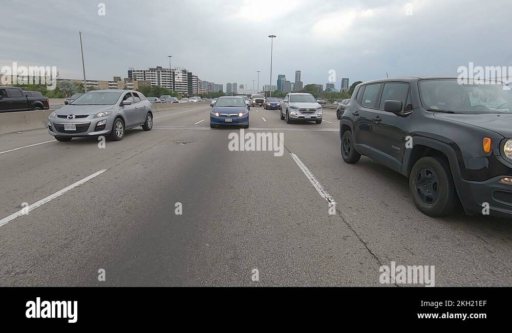 Driving plate reverse POV highway driving with cars and trucks traffic ...