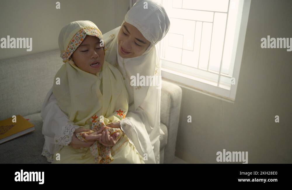 mother teach her daughter to pray with her hand open palm Stock Video ...