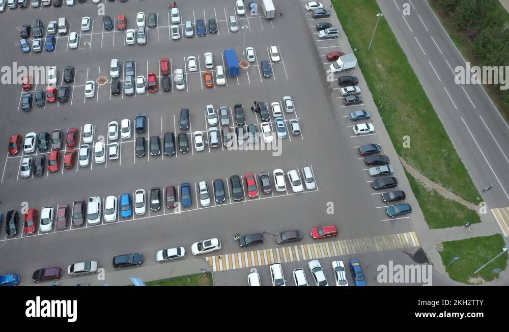 Big street parking with a many parking lots near the mall. View above Stock Video Footage Alamy
