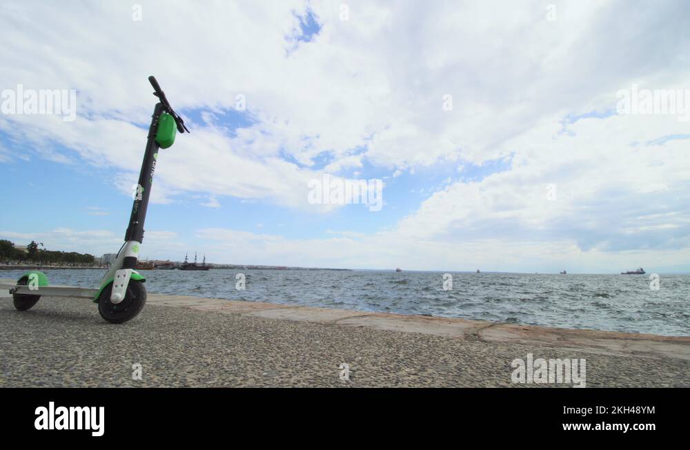 LimeS electric rental scooter parked on the sea front in Thessaloniki