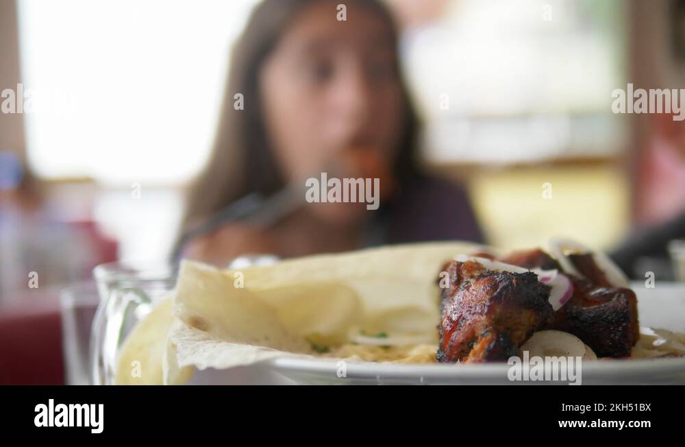 friendly or family dinner. people eat and drink at a big table Stock