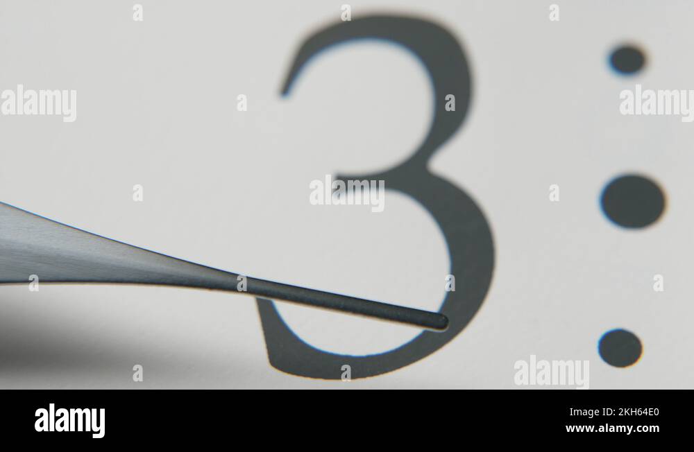 White clock face with an hour hand showing three and a moving second hand Stock Video Footage