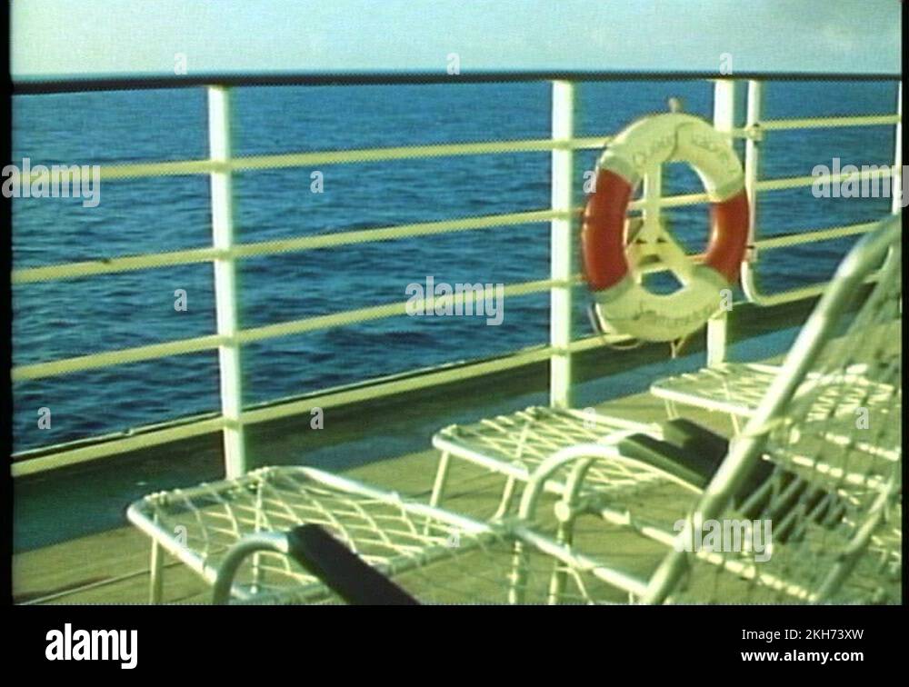 QUEEN ELIZABETH 2, 1985, QE2 deck, rail, ring buoy, deck chairs, sea