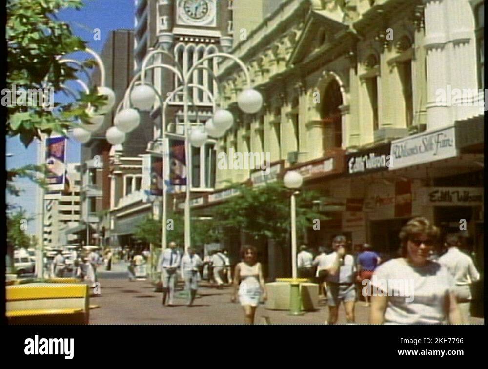 PERTH, AUSTRALIA, 1985, downtown, medium shot, crowd, tilt up clock