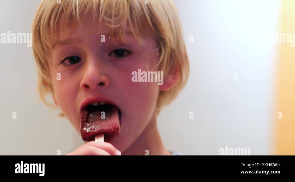 Boy eating ice lolly Stock Videos & Footage HD and 4K Video Clips Alamy