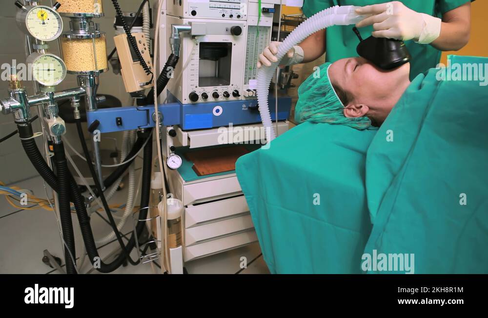 Nurse holding an oxygen mask above the head of patient Stock Video ...