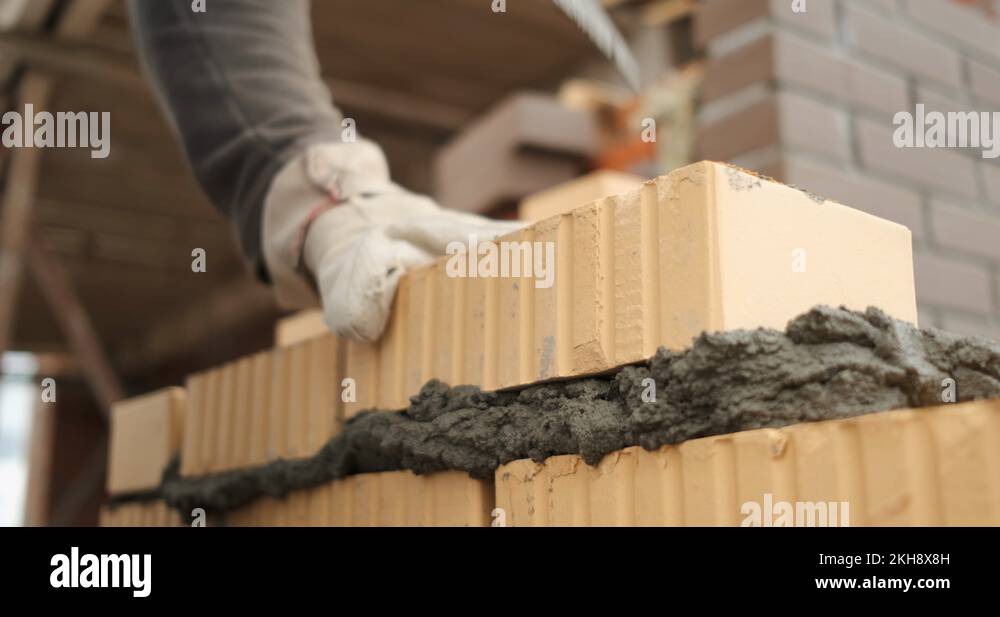 Mason work quickly, build wall of house, erect structure, put bricks in