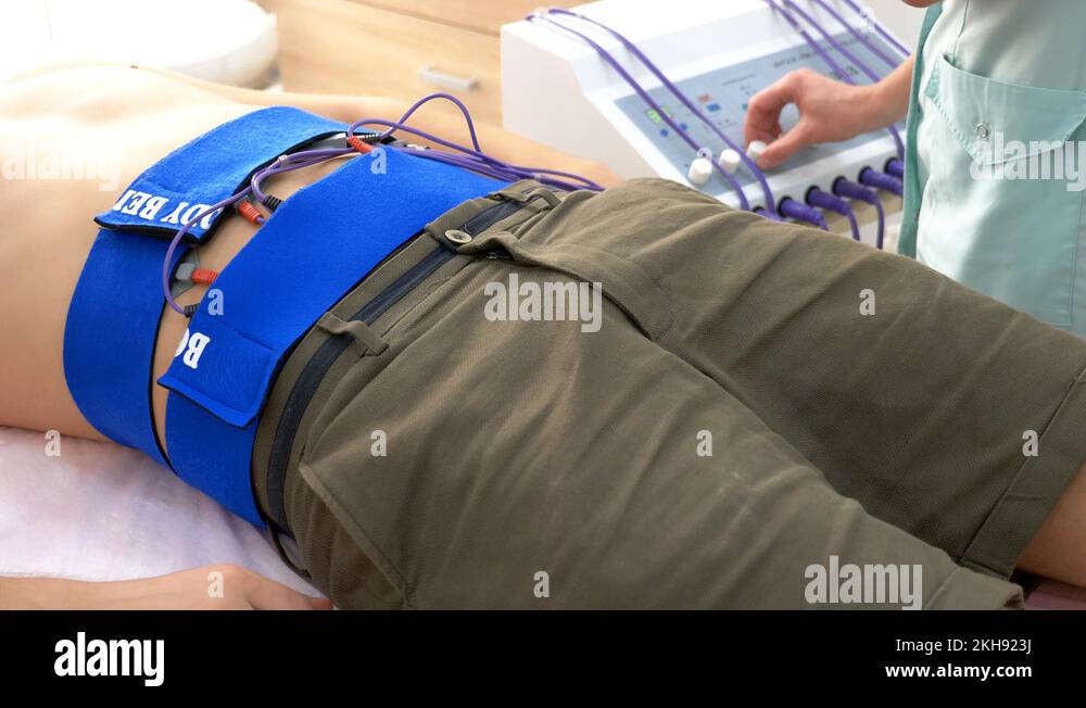 closeup. electrical stimulation procedure for abdominal muscles. a man