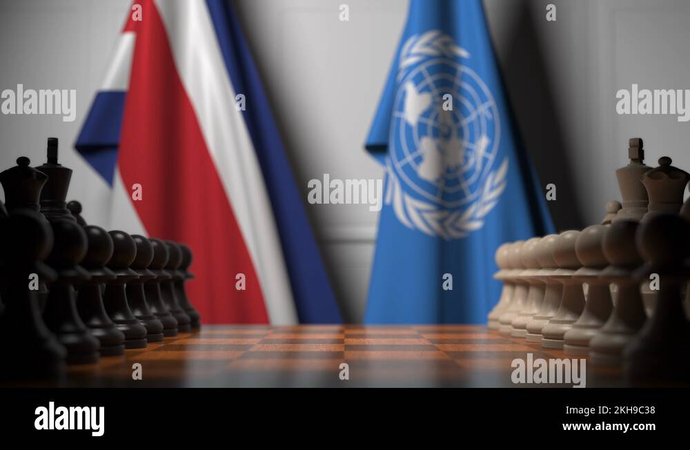 Flags of Costa Rica and United Nations behind pawns on the chessboard