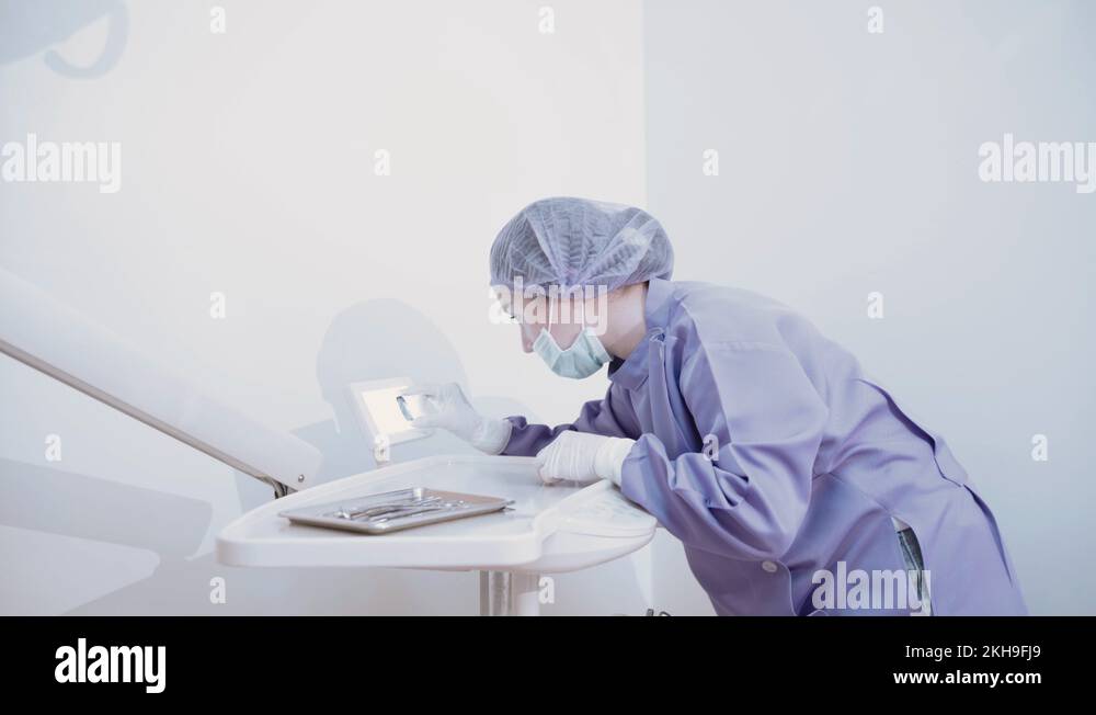 Dentist testing xray film teeth dental care monitor oral patient Stock