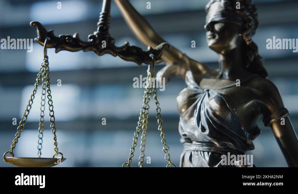 Close up and medium Lady Justice blindfolded and holding balance scales