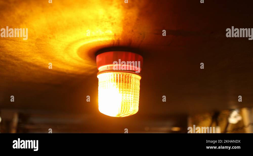 Flashing light alert. Orange flashing and revolving light on top of a