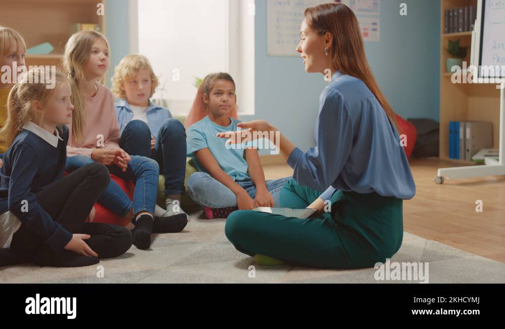 School Class: Children Sitting on Bean Bags while Teacher Explains ...