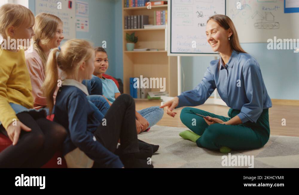 School Class: Children Sitting on Bean Bags while Teacher Explains ...