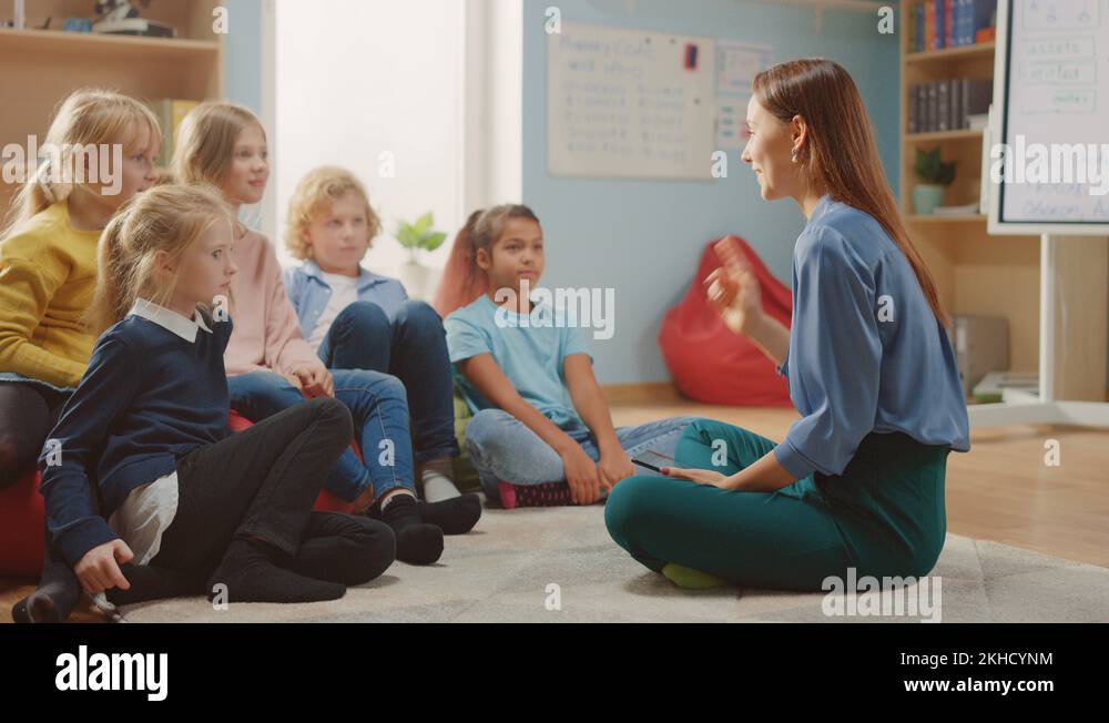School Class: Children Sitting on Bean Bags while Teacher Explains ...
