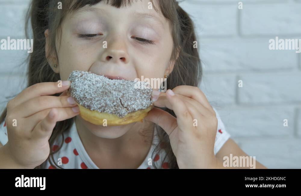Eat a doughnut Stock Videos & Footage HD and 4K Video Clips Alamy