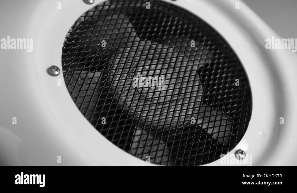 Dark dusty fan blades begin to rotate and gradually increase speed in the whi Stock Video