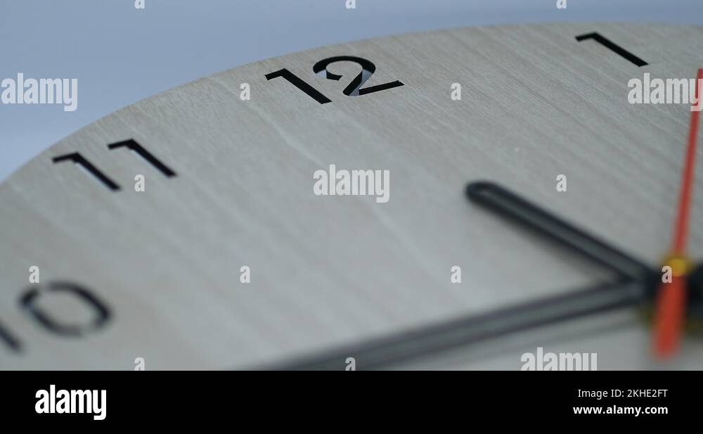 footage time lapse clock with three arrow white hands moving fast to 12