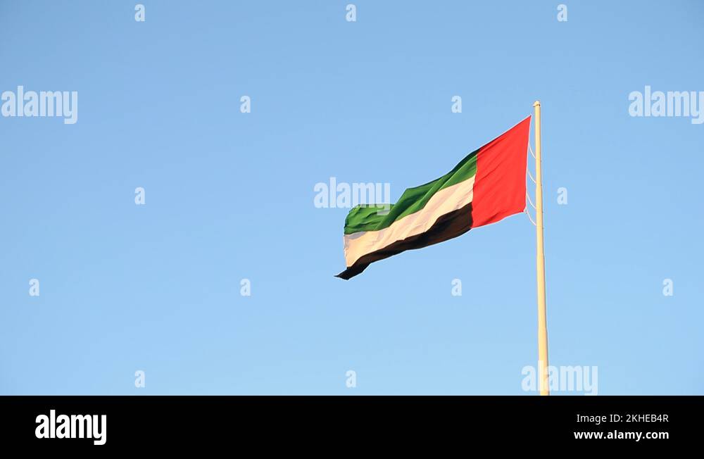 UAE flag waving in the sky, national symbol of UAE Stock Video Footage
