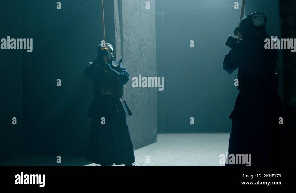 Japanese kendo fighters with bamboo swords competing in dark mystic