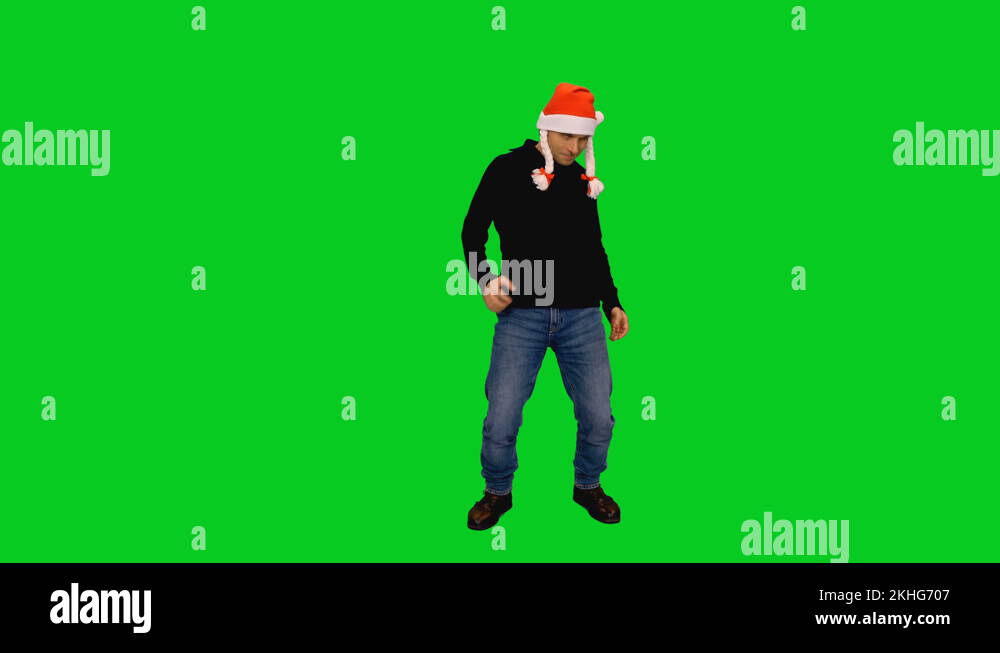 Funny Adult Man In Santa Hat Dancing On Green Screen Background Chroma funny-adult-man-in-santa-hat-dancing-on-green-screen-background-chroma