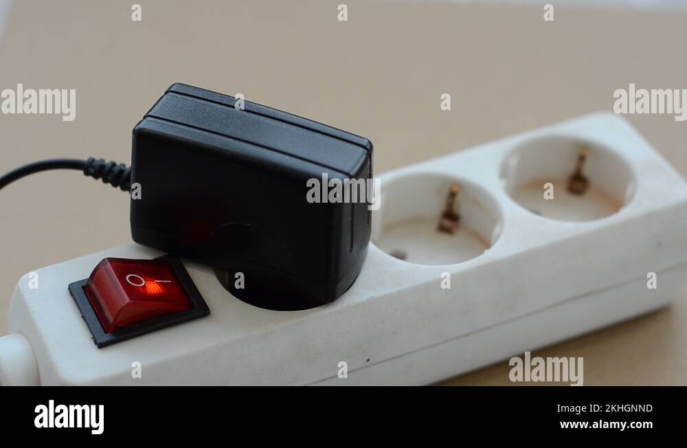 Disconnecting the power supply to a power outlet and disabling the power button Stock Video