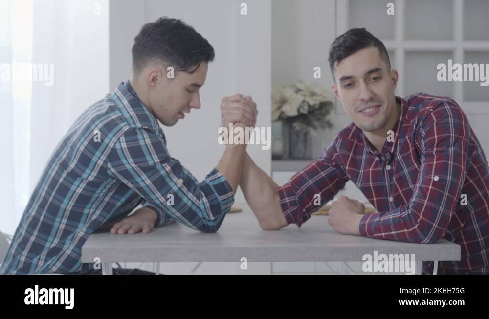 Caucasian brothers arm wrestling Stock Videos & Footage HD and 4K