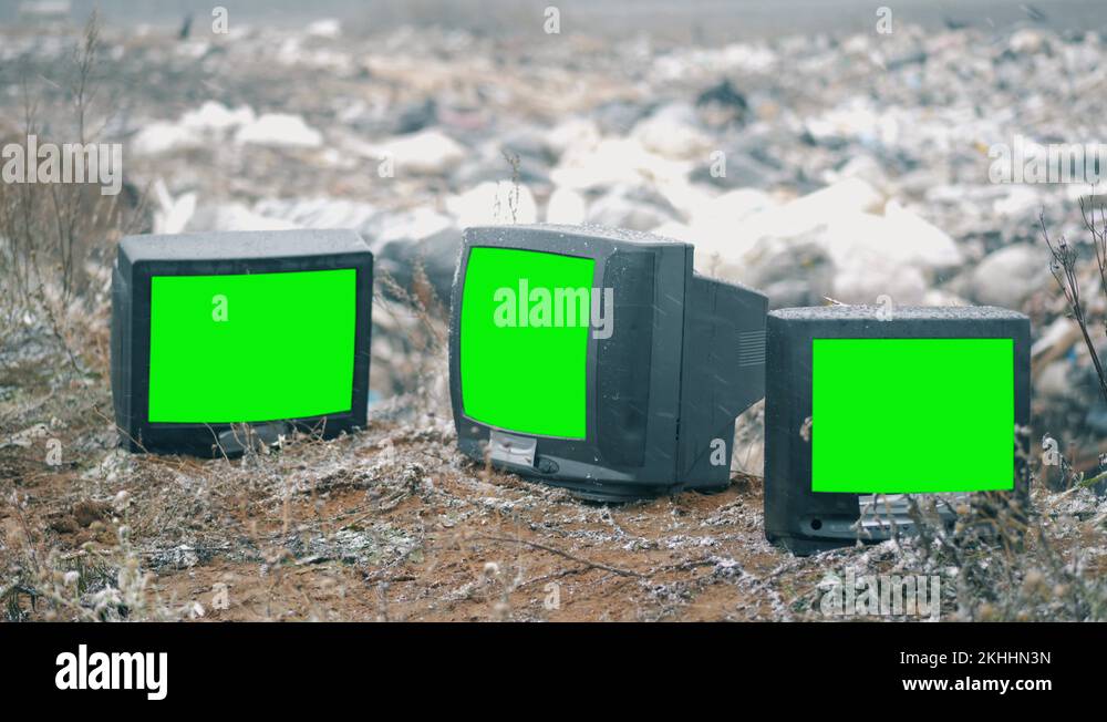 TVs with green screens on a landfill Stock Video Footage Alamy