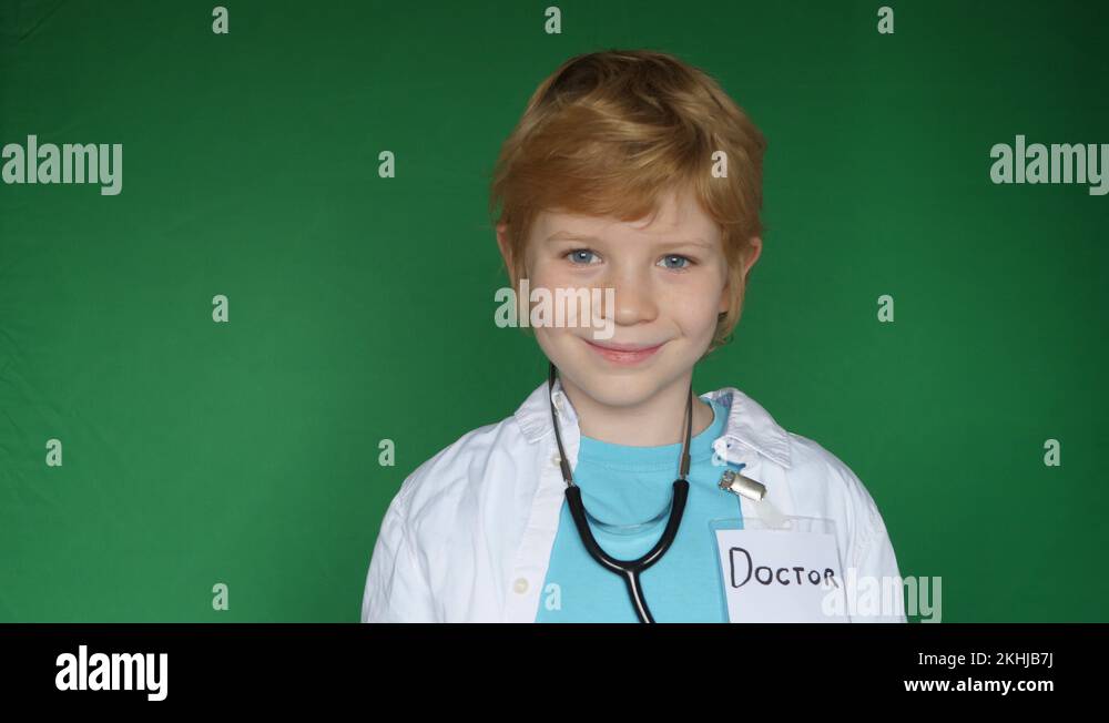 Young boy dressed as a doctor with a stethoscope for green screen