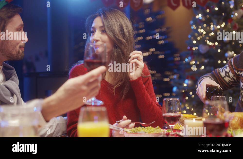 Romantic man making a toast for his beautiful girlfriend, sitting