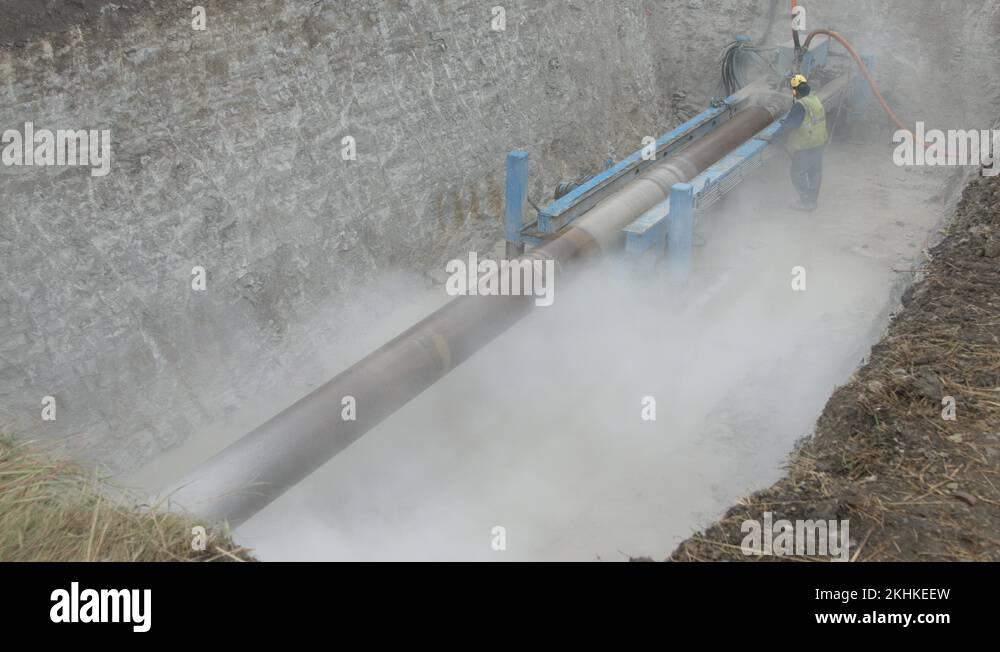 Horizontal hydraulic drill rig drilling into limestone rock Stock Video