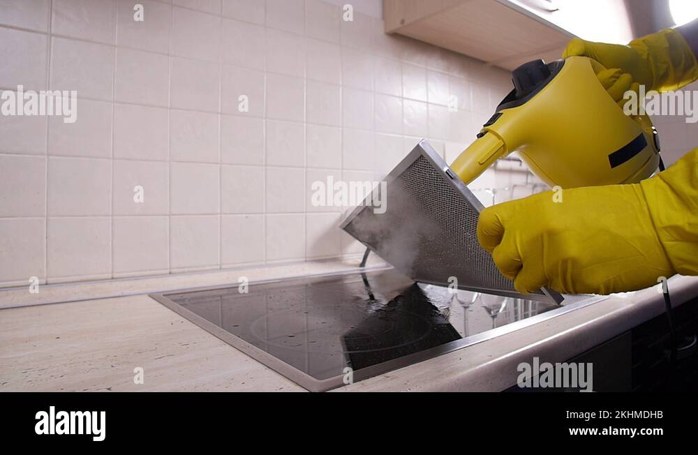 House cleaning concept. Professional janitor cleaning mesh filter of