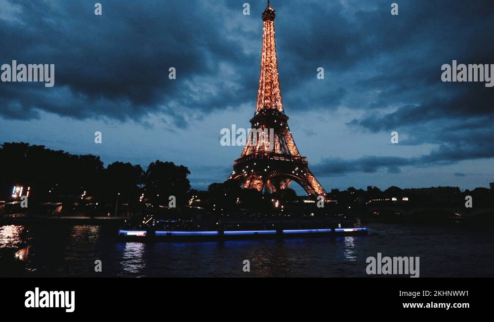 The Eiffel Tower lights up in Paris, and the boats pass through the