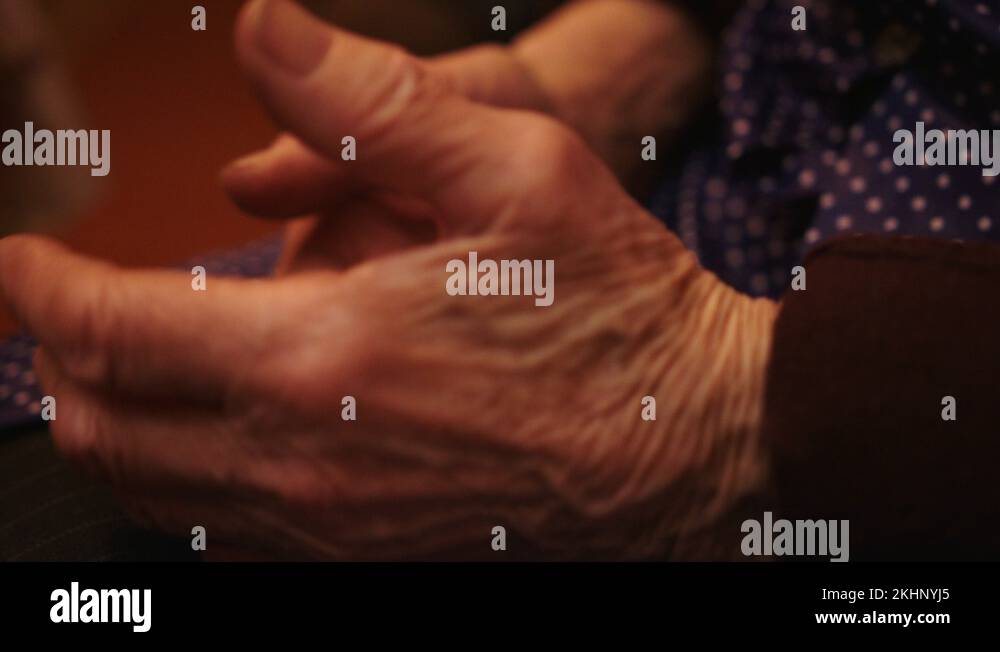 Wrinkled hands of granny. Hand gesticulation extreme close up