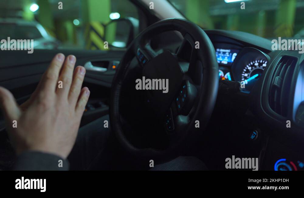 Man driving in innovative automated car using selfparking autopilot