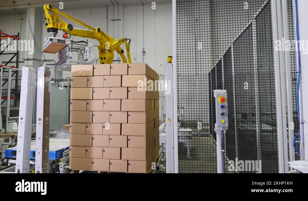 Pallet shrink wrapping robot arm in warehouse Stock Video Footage Alamy