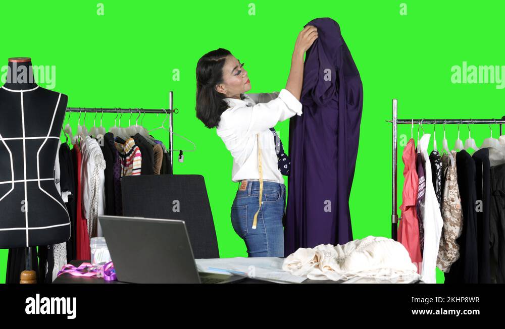 Female designer fitting a dress on a mannequin Stock Video Footage Alamy