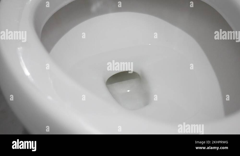 Close up of Water drained into the toilet bowl. Flushing Water in flush