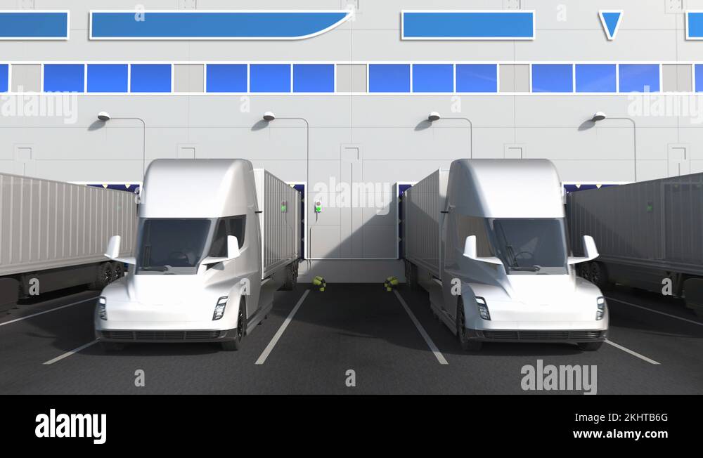 Modern semitrailer trucks at warehouse loading bay with IBM logo on