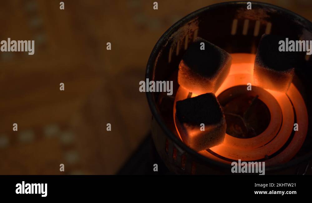 Hot coals burn on old retro electric camping stove. Top View. Hookah