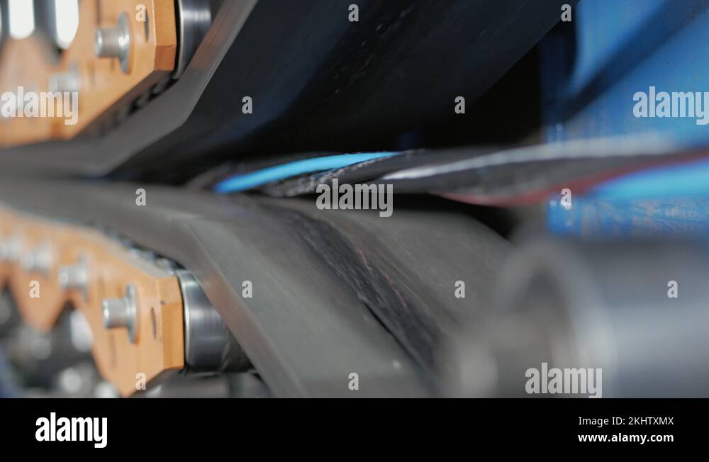 The multi-core cable in the shell moves along the conveyor line Stock ...
