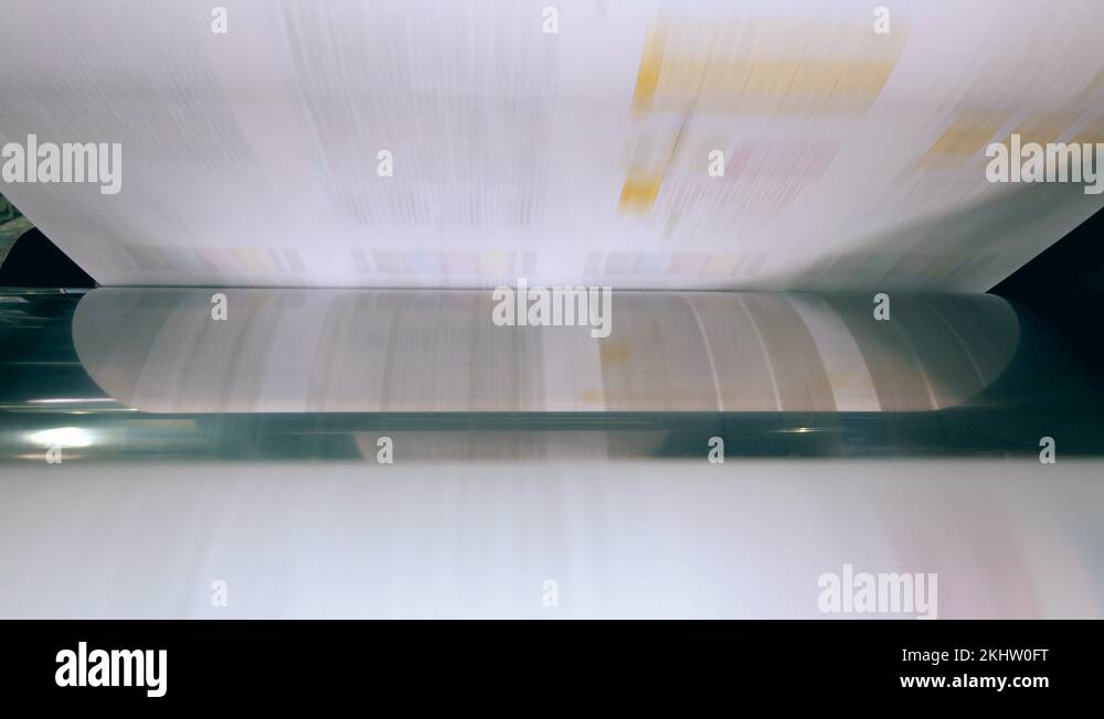 Paper is moving through typography rolling mechanism. Paper production