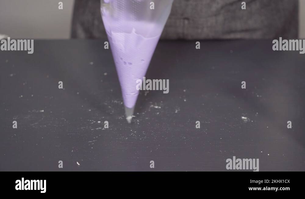 Mixing in food coloring into the royal icing to decorate sugar cookies