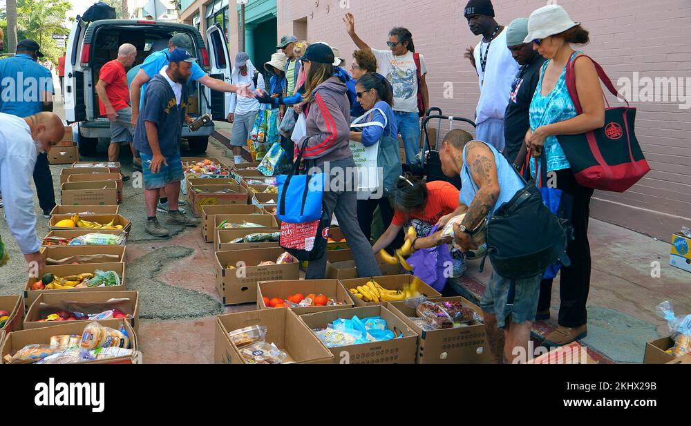 Volunteers feed homeless people and serve food in Los Angeles