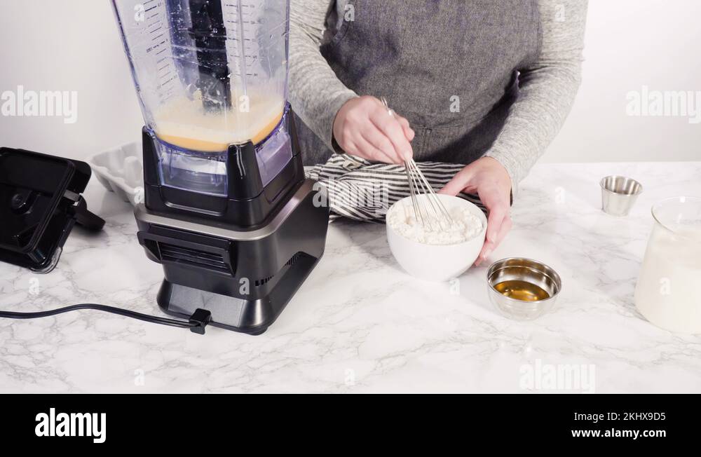 Mixing ingredient in an electric blender to make the crepes batter