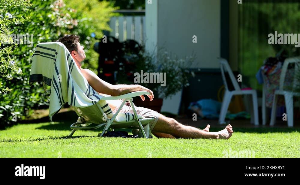 Man sunbathing in yard Stock Videos & Footage HD and 4K Video Clips