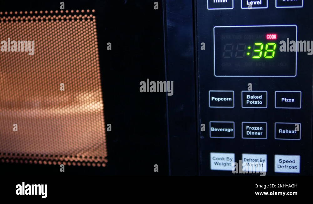 Motion of food being heated in microwave oven with 4k resolution Stock