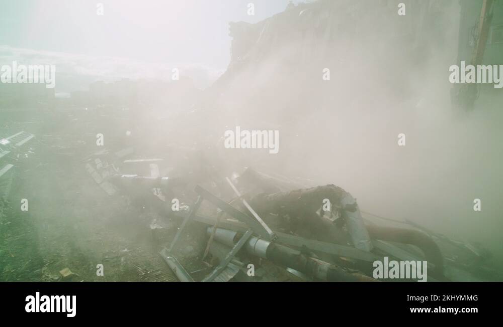 open demolition site of ruined hockey arena in dust cloud Stock Video